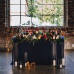 main theme, dark blue floral composition, lights ready for wedding